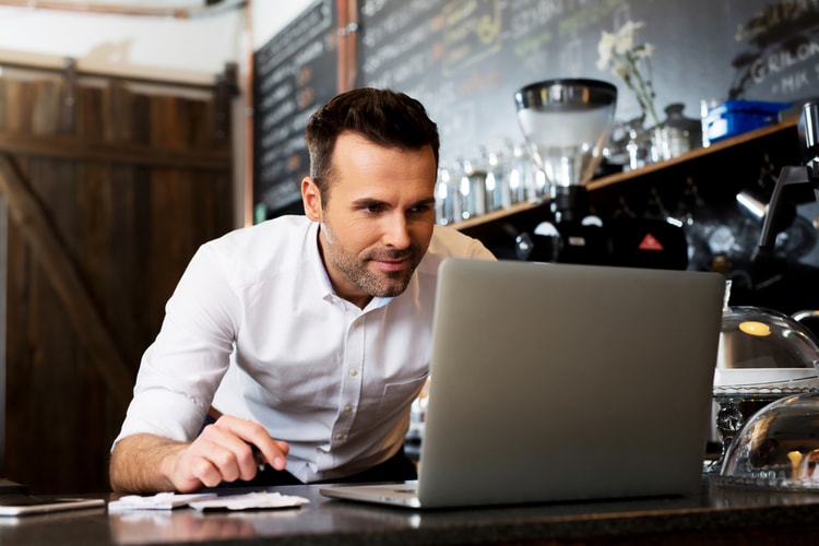 Happy man building a website with Weebly Happy man building a website with Weebly
